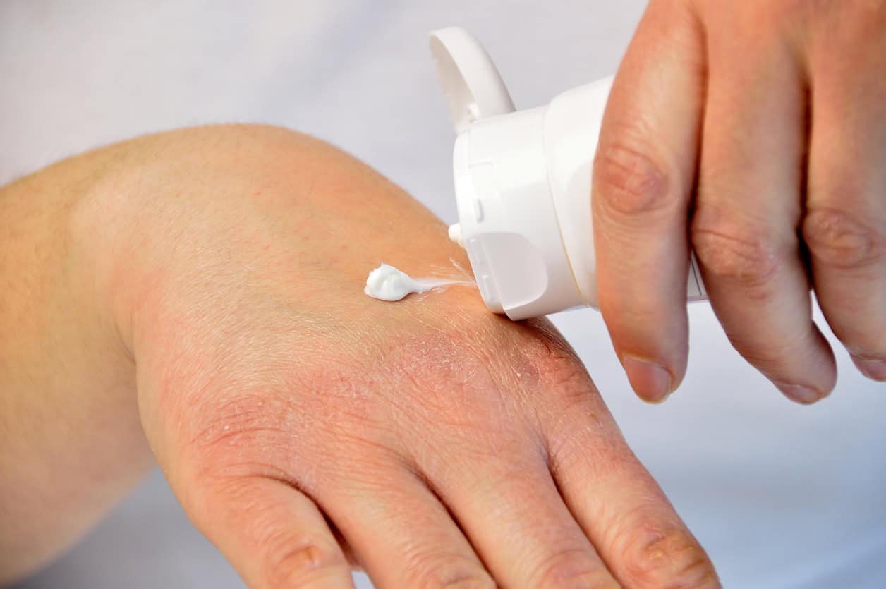 Hands getting moisturizer on them