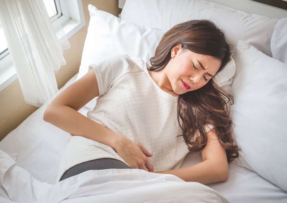 Woman experiencing pain from kidney stones.