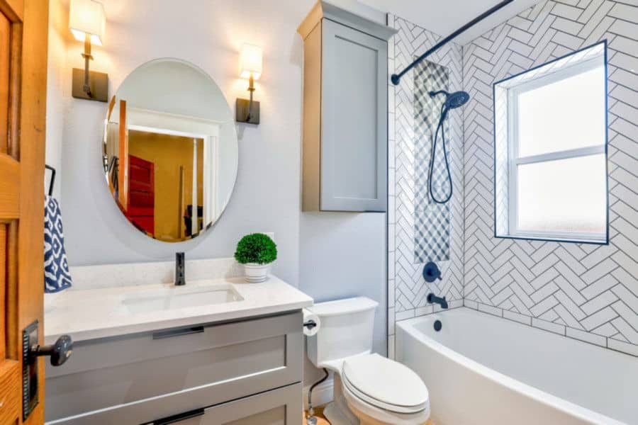Freshly cleaned white porcelain bathroom tube and shower tile