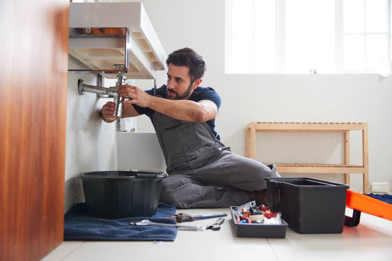 chaska plumber fixing leaky sink in home bathroom