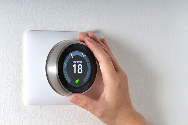 Hand adjusting smart thermostat