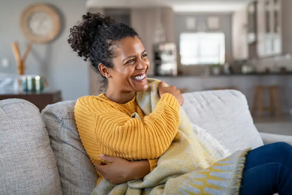 a woman sitting on a couch