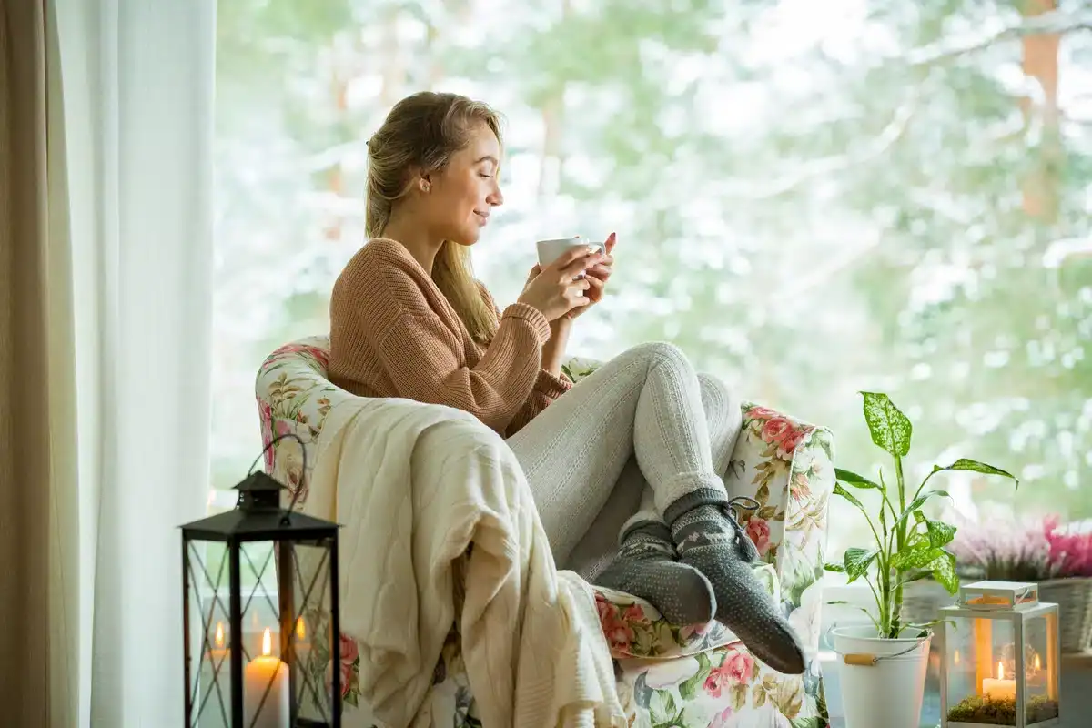 woman in warm home with effiicent heat pump