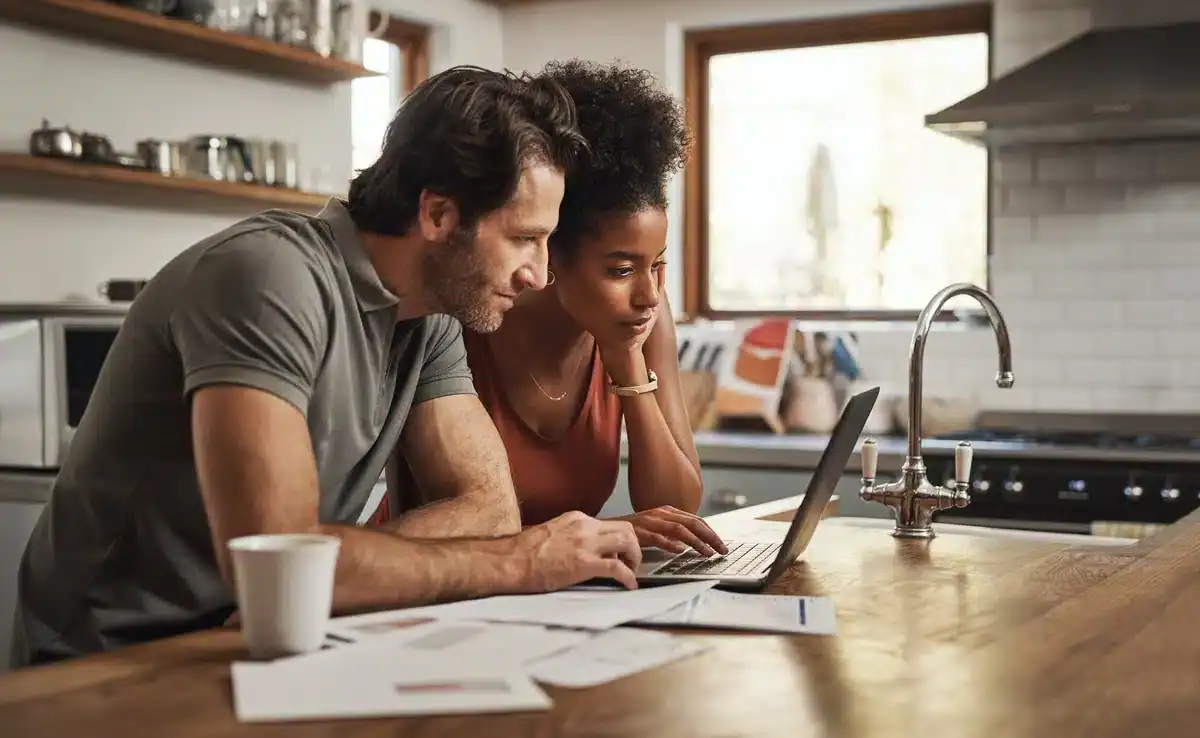 couple paying their house electricity bill