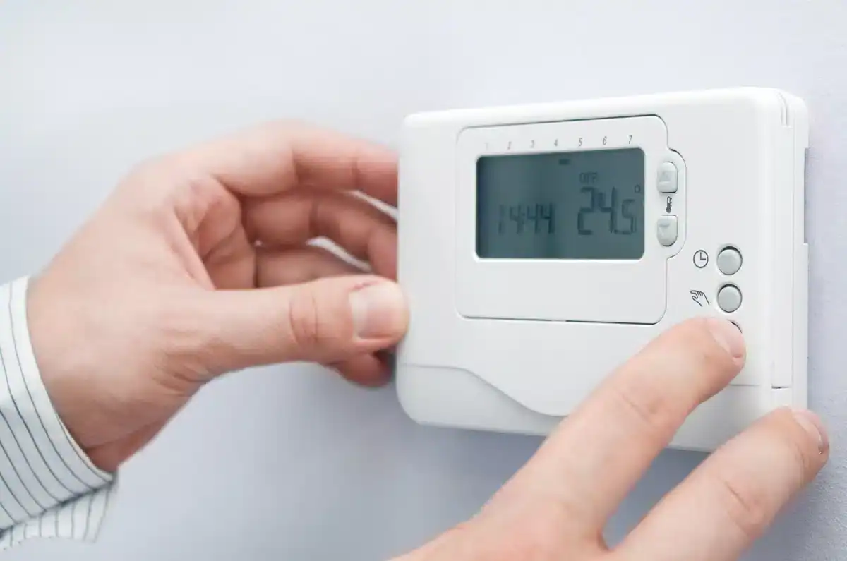adjusting the thermostat