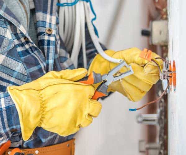 electrician installing electrical wiring