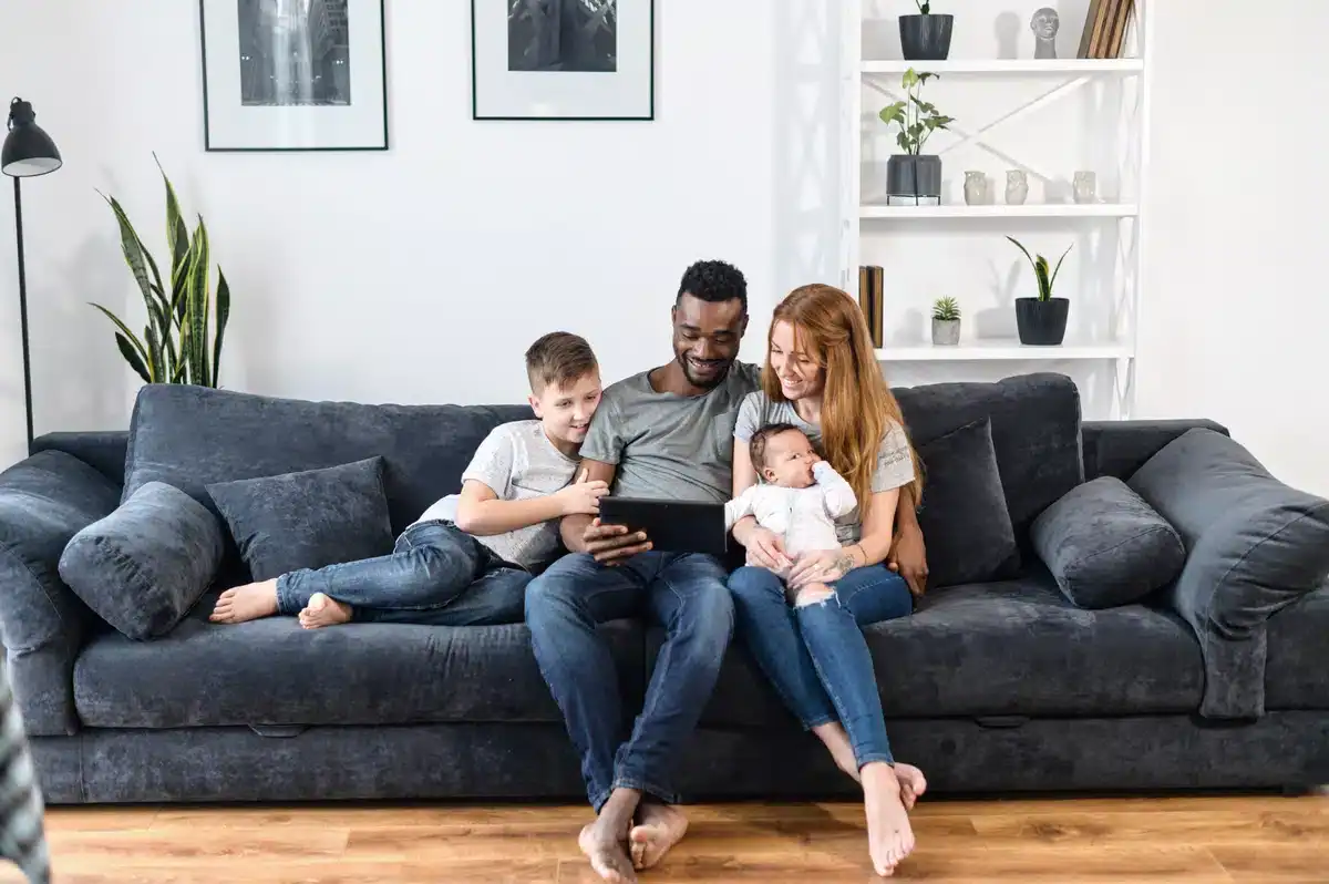family relaxing on the sofa