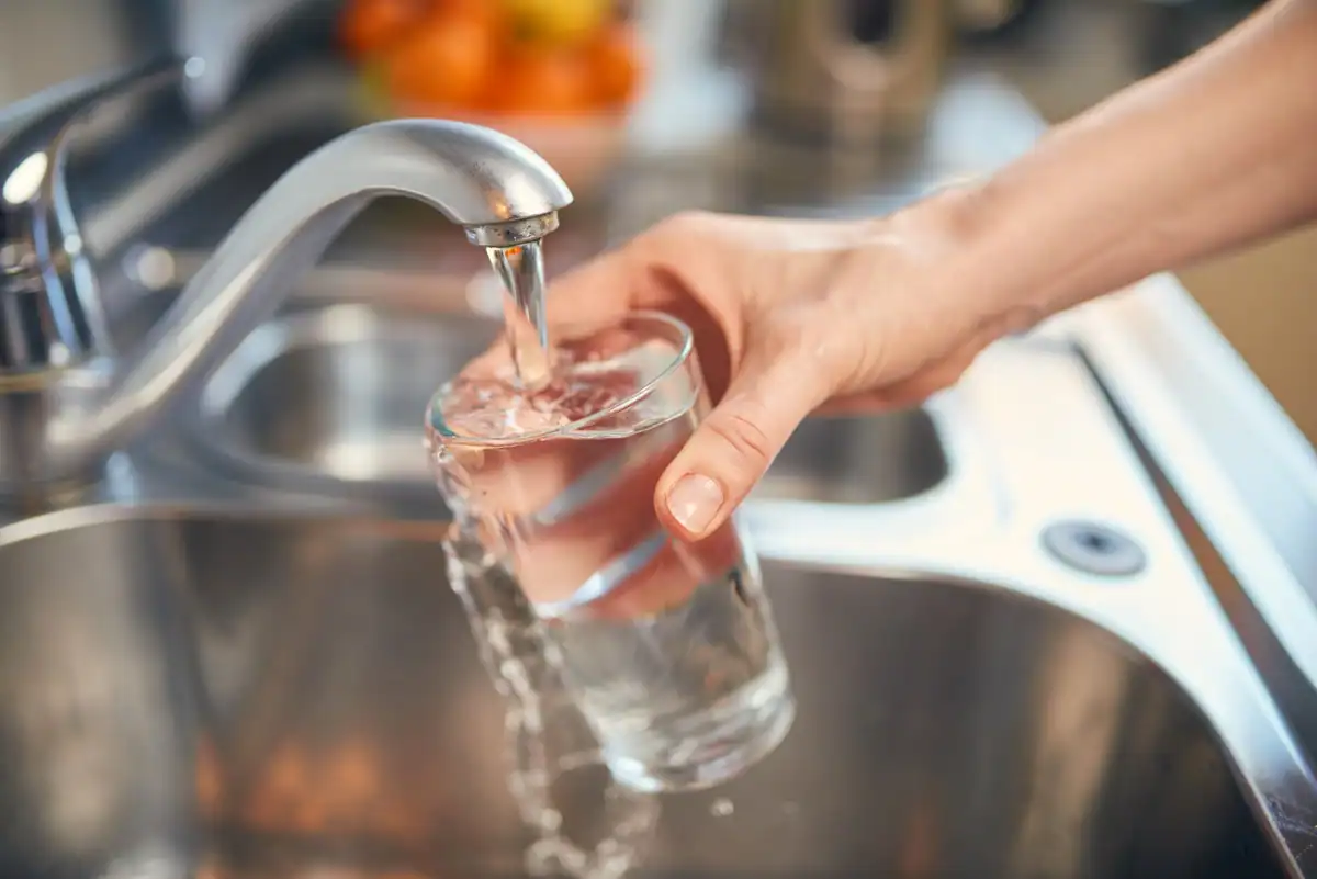 pouring tap water to glass