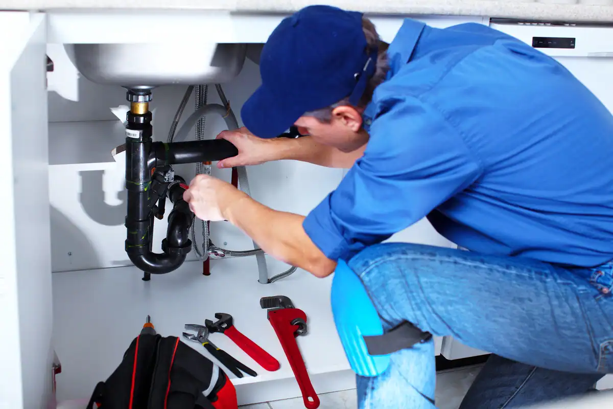 burnsville plumber fixing sink