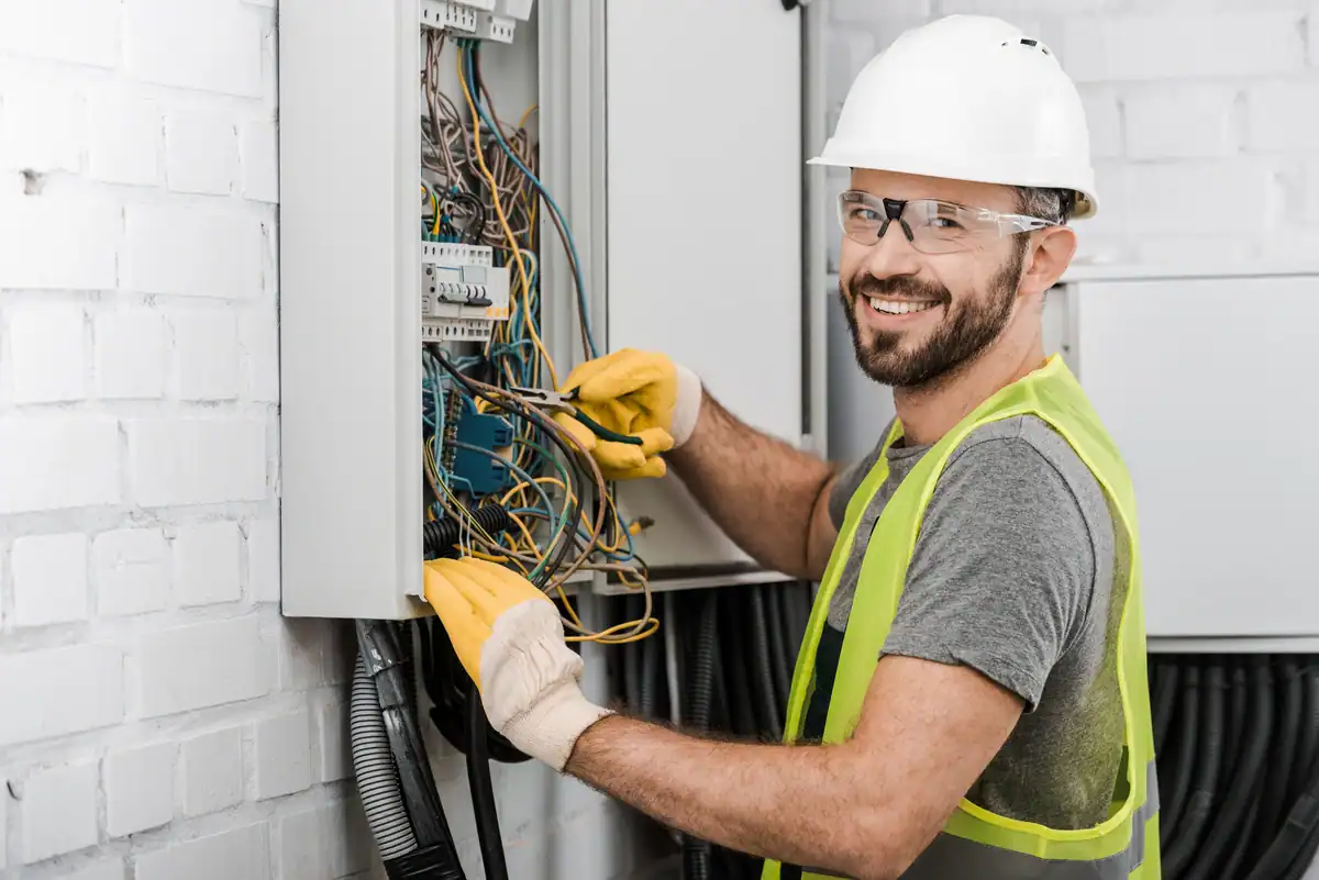 Detroit Lakes' Reliable Electrician fixing a cable box