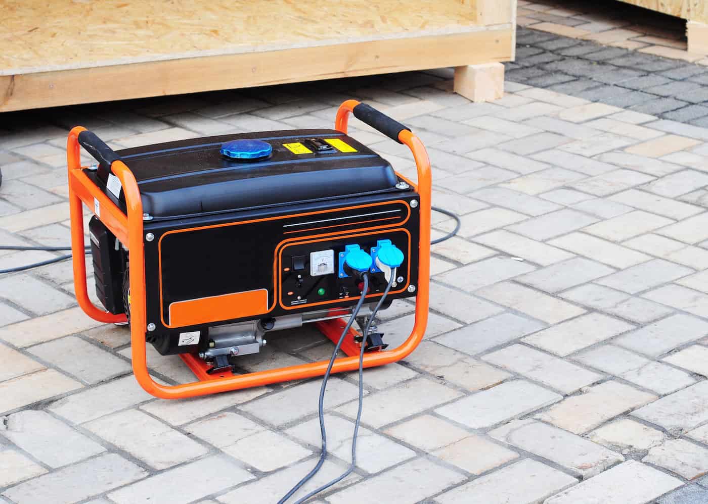 Gasoline Portable Generator On The House Construction Site. Close Up On Mobile Backup Generator .standby Generator Outdoor Power Equipment