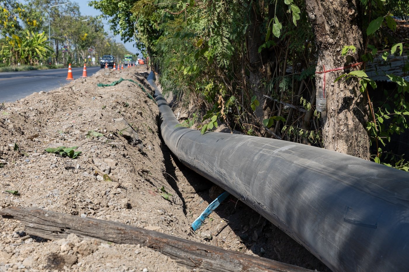 Construction Site With New Water Pipes In The Ground. Sewer Pipes To Repair Or Restore In Street City