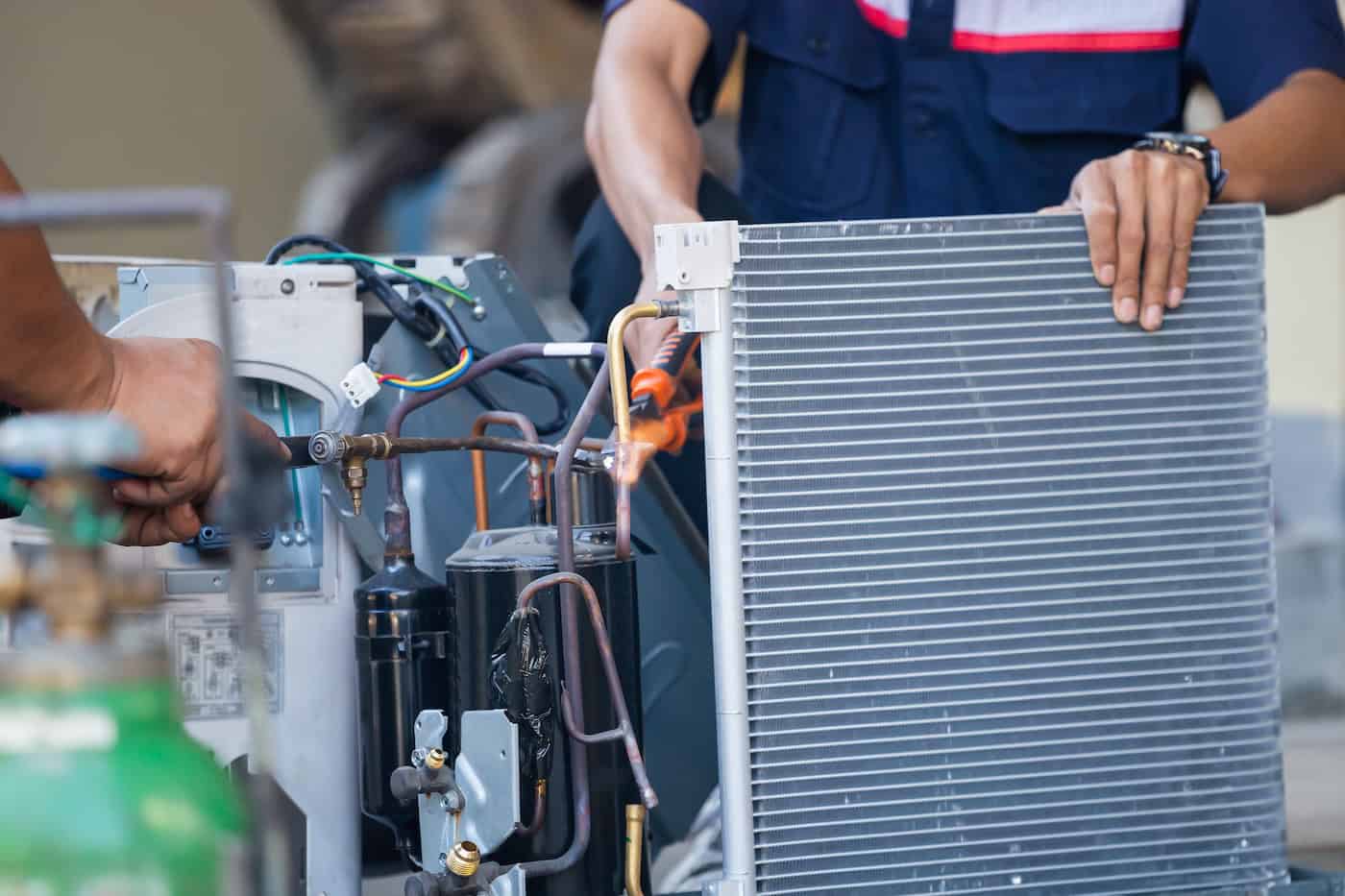 Air Conditioning Repair Team Use Fuel Gases And Oxygen To Weld Or Cut Metals, Oxy Fuel Welding And Oxy Fuel Cutting Processes, Repairman On The Floor Fixing Air Conditioning System