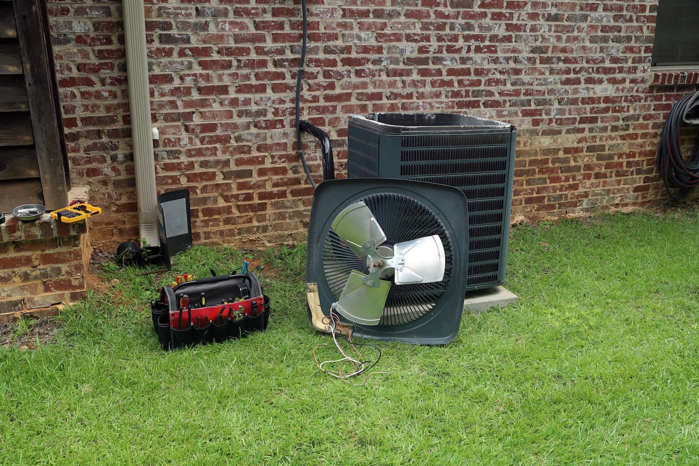 Air Conitioner Condenser Coil With Tools Being Repaired