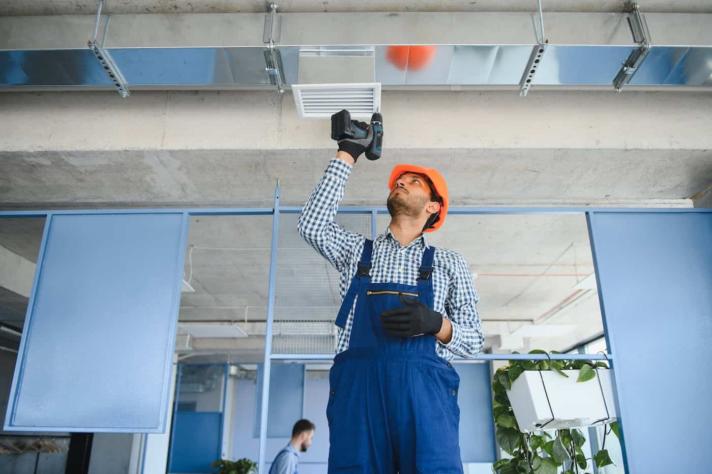 Hvac Services   Worker Install Ducted Pipe System For Ventilation And Air Conditioning In House