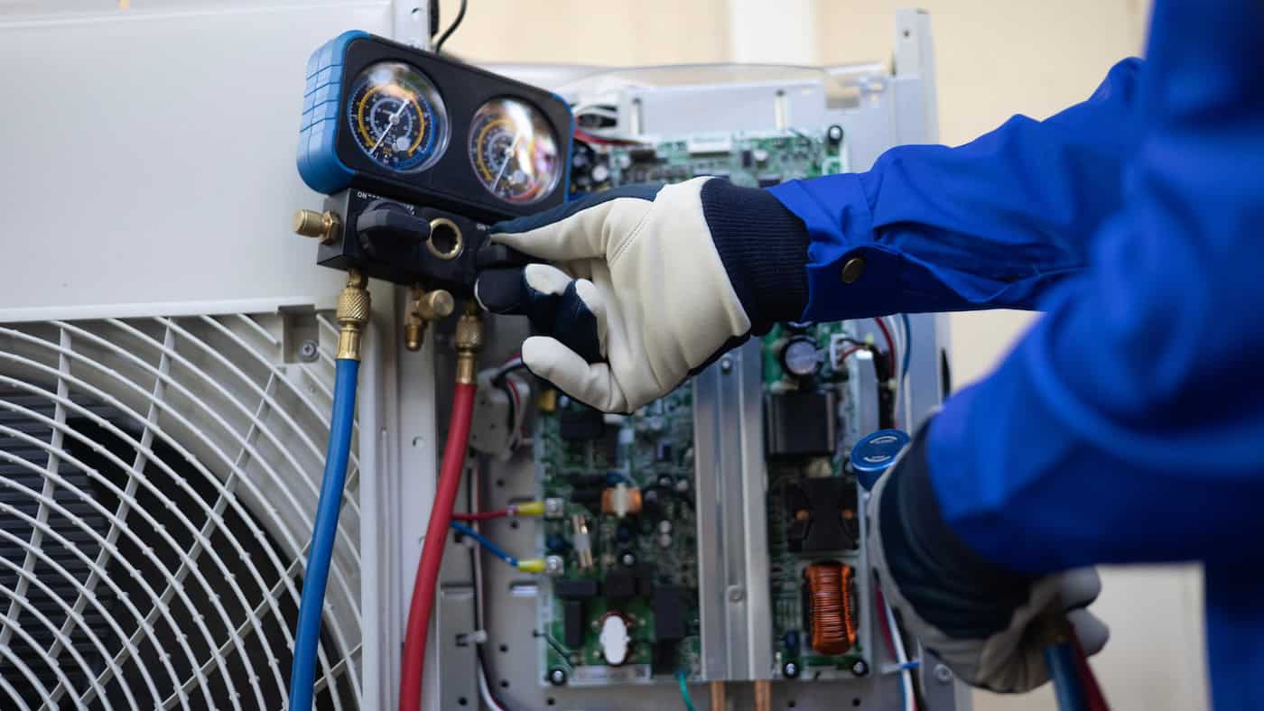 Close Up Air Conditioner's Technician Hand Check  Fill Refrigerant Liquid And Maintenance Condensor Unit, Home Care Service