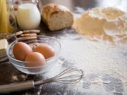 Baking ingredients on a counter covered in flour