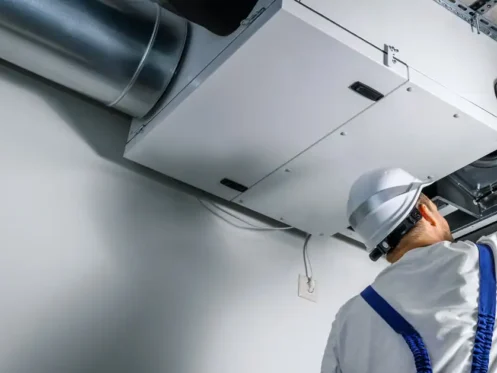 working on a ventilation system